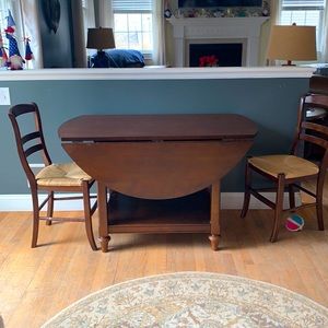 Pottery barn table and two chairs. Mahogany